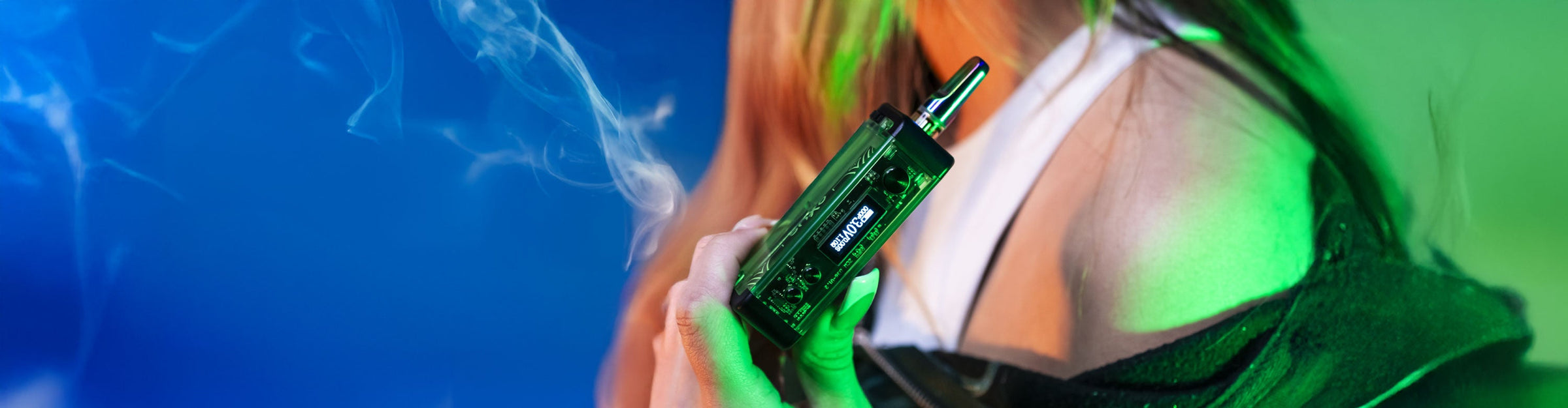 Woman holding Vader Edition Exxus Snap VV Oil Cartridge Vaporizer outside at pumpkin patch