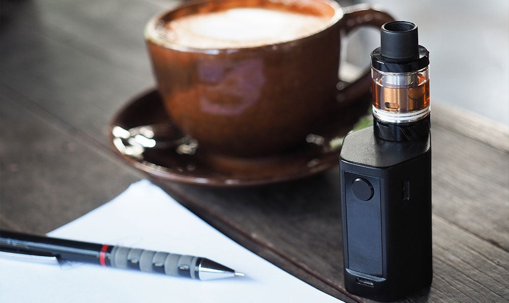 Direct to lung vaporizer standing on a coffee table