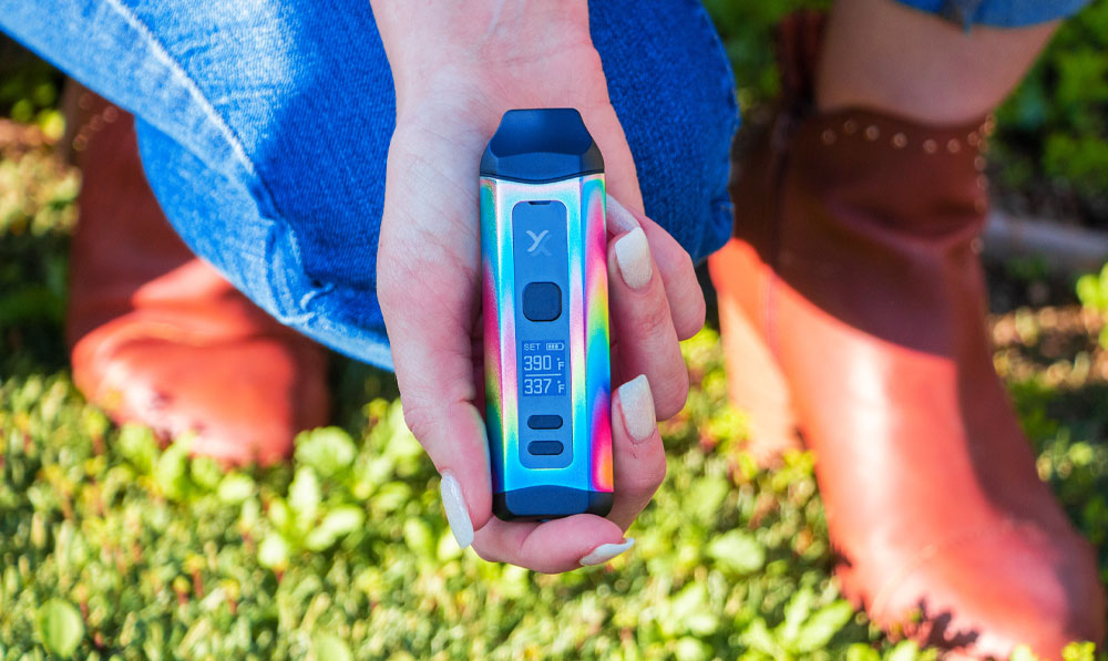 Woman holding Exxus Mini Plus