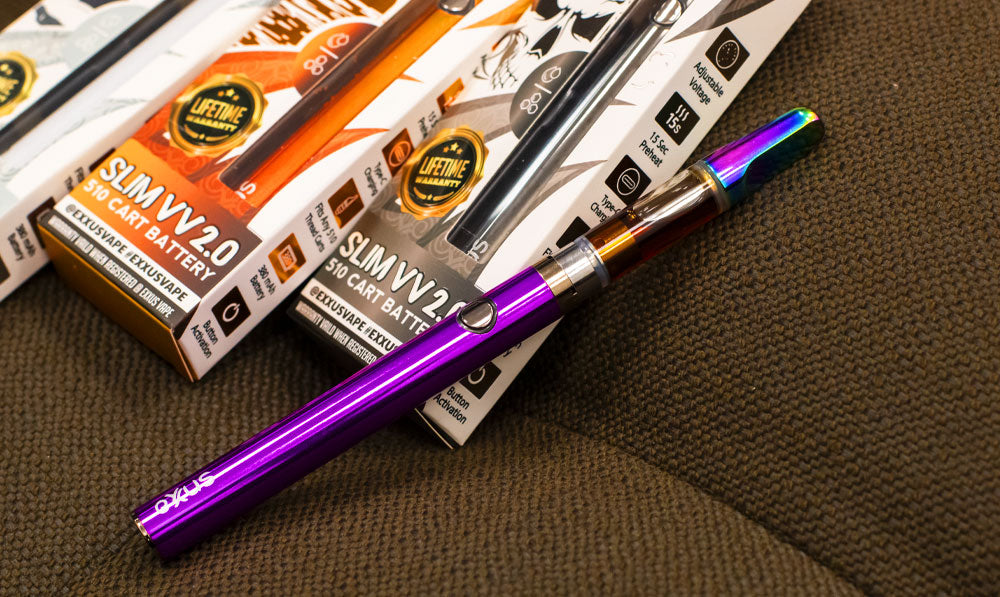 Exxus Slim VV 2.0 resting against a couch with other units in packaging nearby