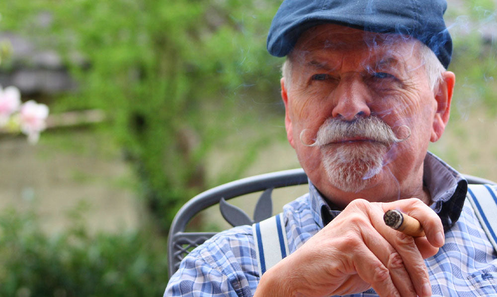 Senior relaxing in a chair with natural lighting