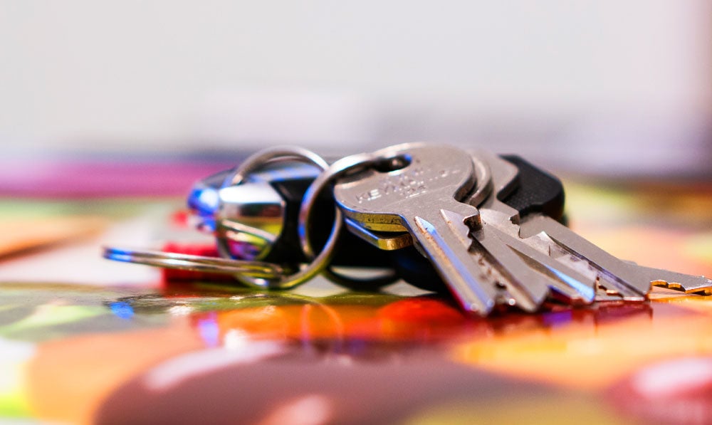 Keys resting on a table with a lanyard attached