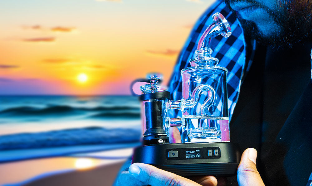 Man holding Exxus Go Plus near sunset at a beach