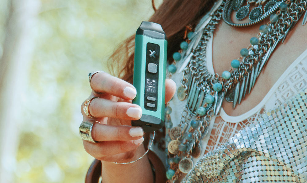 Woman holding Exxus Mini Plus in sunny area