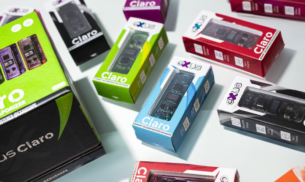 Exxus Claro units resting with packaging on white surface