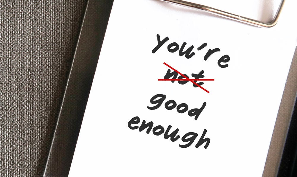 "You're good enough" mantra on a notebook