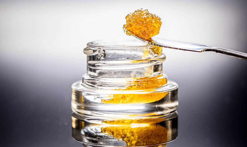 wax concentrate inside container with dab tool