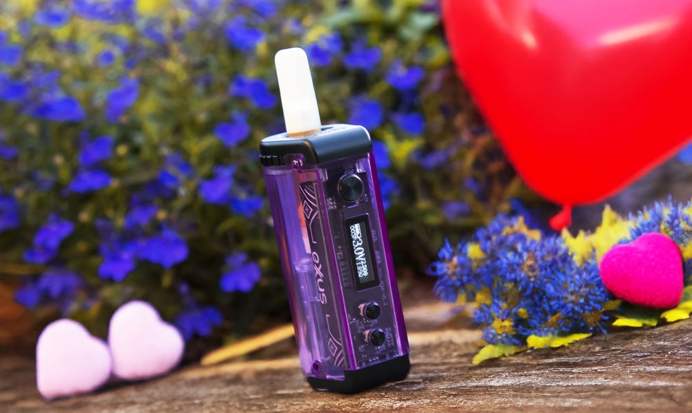 Purple Exxus Adapt vaporizer with a Valentine's balloon and flowers