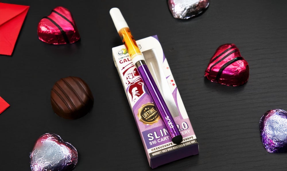 Exxus Slim 2 510 thread battery beside boxed chocolates