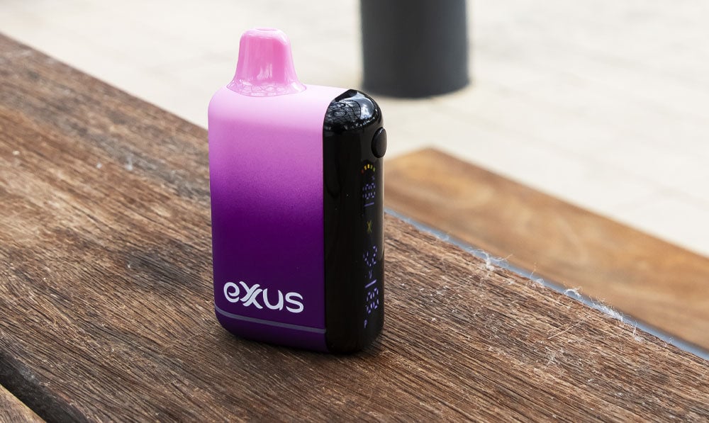 Purple Exxus Snap DLX 510 thread battery on a wooden bench