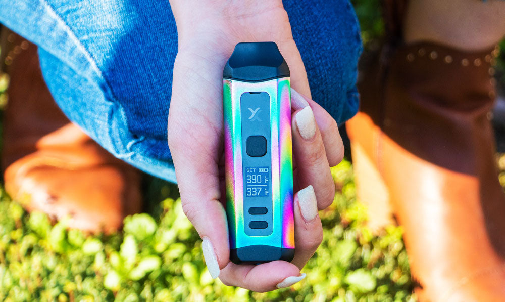 Woman holding Exxus Mini Plus during spring