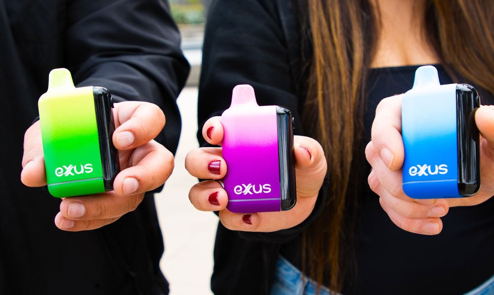 Group of people holding Exxus Snap DLX outside