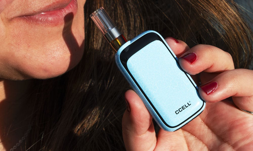 Smiling woman holding Exxus Crackle Rizo