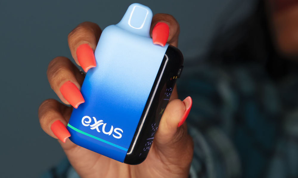 Woman holding Exxus Snap DLX in studio with unit on