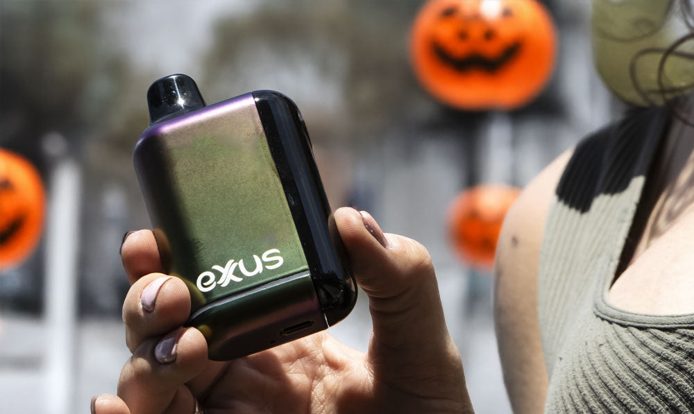 Woman holding Exxus Snap DLX in street with Halloween decorations
