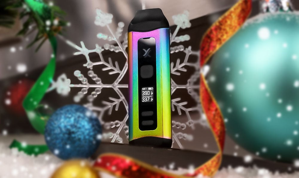 Rainbow Exxus Slim Plus 510 thread battery on a surface with snowflakes and baubles