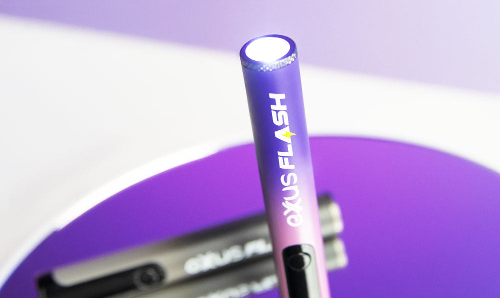 Exxus Flash on circular reflective surface with purple lighting