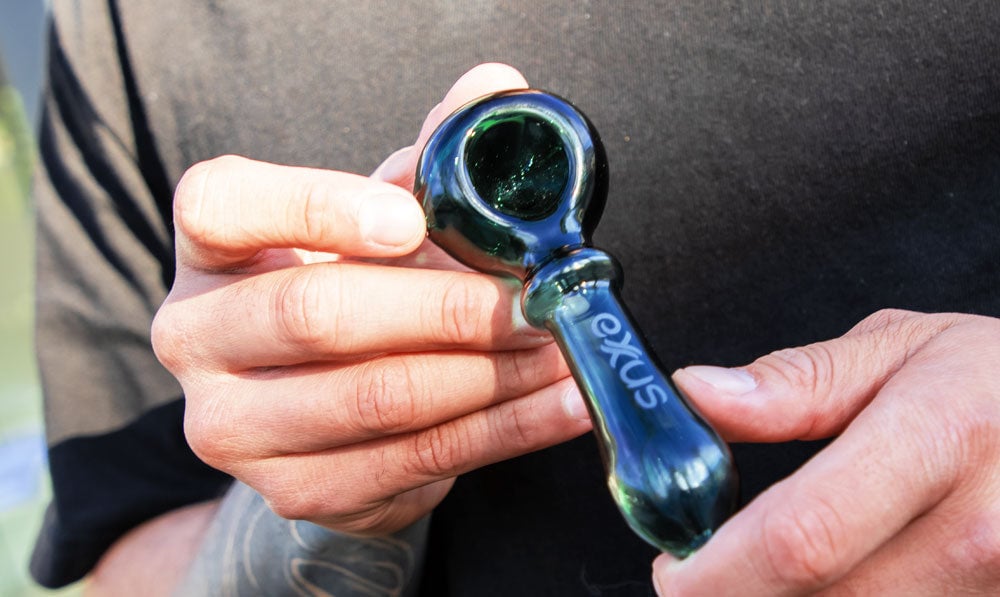 Closeup of man holding Exxus Wand