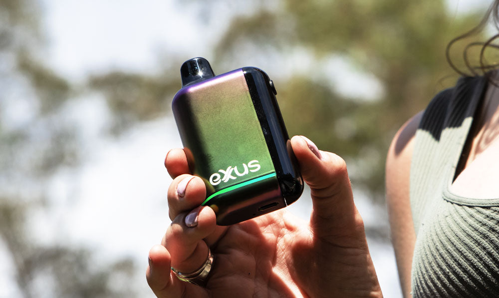 Woman holding Exxus Snap DLX up near sunlight