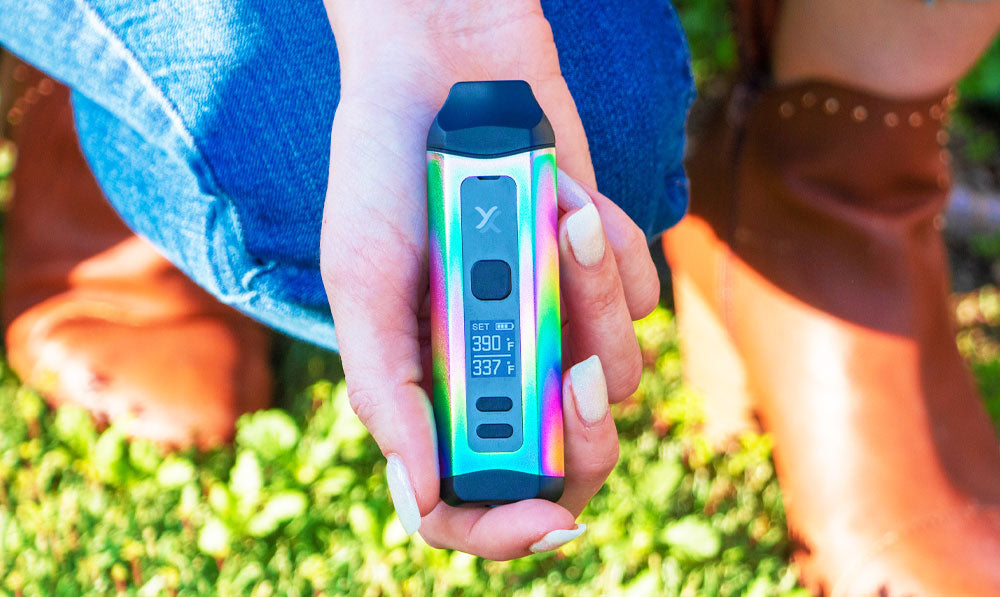 Woman kneeling with Exxus Mini Plus in hand