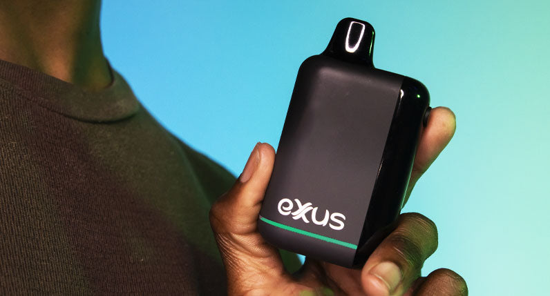 Man holding Exxus Snap DLX in front of blue studio background