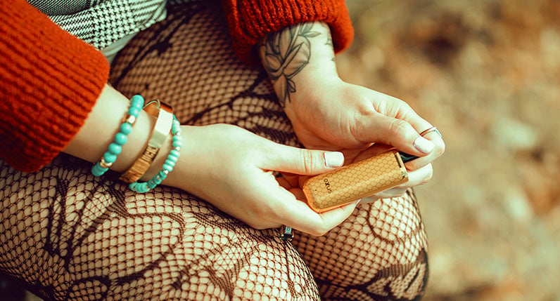 Girl holding gold Exxus Minovo