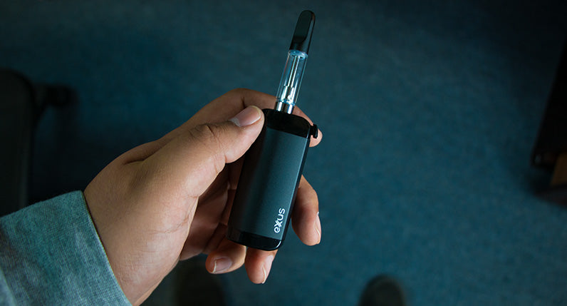 Man holding gunmetal Exxus VRS over the floor